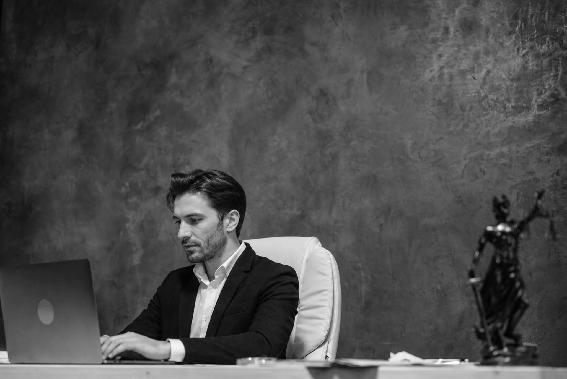 An attorney working at a desk in the firm's office